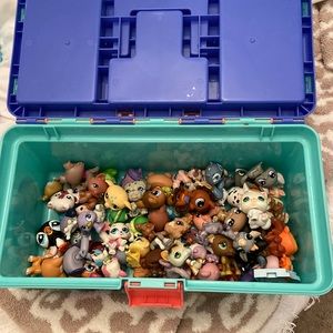 My littlest pet shop collection and carrier box. Random assortment of pet shops.